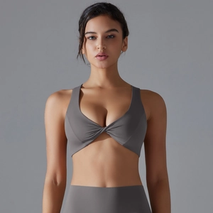 Detailed front view of sports bra with twist-knot design and moisture-wicking fabric