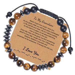 Detail of 8mm tiger eye beads and matte stones on a Morse code bracelet with gift card