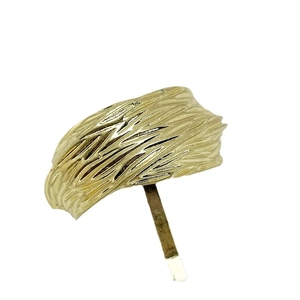 Golden minimalist hair clip with irregular texture and sleek metal pin fastening