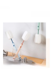 Detailed view of long-handled sponge brushes in blue, pink, and green for bottle cleaning