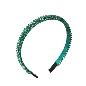 Elegant emerald green beaded headband with four rows of faceted crystal stones
