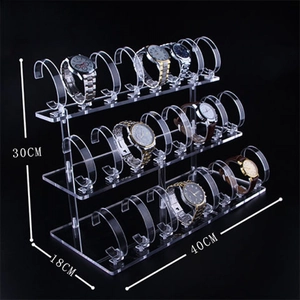 Three-tier clear acrylic watch display stand measuring 40x18x30cm on black background