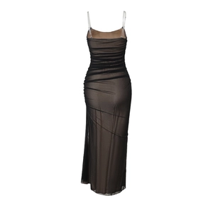 Detail of elegant mesh ruched long dress with thin straps and slimming bodycon silhouette