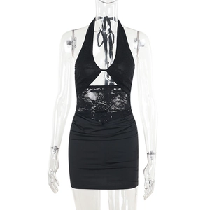 Close-up of black halter neck dress with sheer lace patchwork and slim bodycon fit