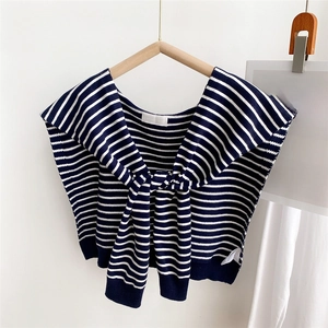 Close-up of navy and white striped knit shawl with nautical collar and tie front