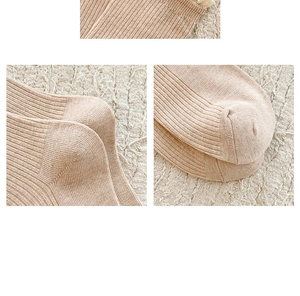 Detail view of cotton rib knit texture with reinforced heel and toe in light beige