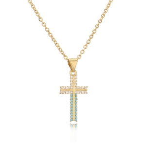 Golden cross necklace with inlaid white zirconia and turquoise stones on a white background