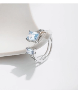 Close-up of double-layer S925 silver ring with light blue rectangular crystals