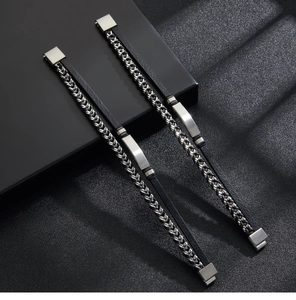 Macro view of braided black leather bracelet with silver metal chain and magnetic clasp