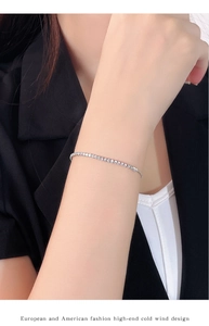 Close-up of minimalist S925 silver square diamond tennis bracelet on a wrist