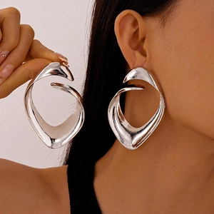 Exaggerated silver irregular geometric earrings with liquid metal flow style for women