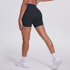 Rear view of high-waisted black yoga shorts with white contrast waistband trim