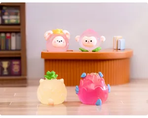 Miniature resin figurines of glow-in-the-dark zodiac fruits on a mini desktop shelf