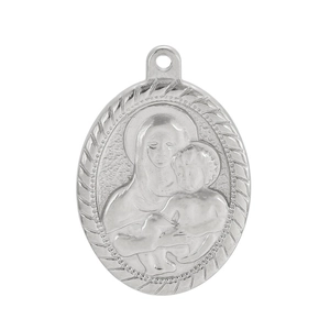 Detail of silver oval Virgin Mary pendant with embossed religious motif and textured edge
