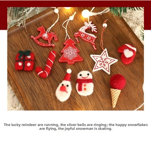Detail of wool felt and wooden Christmas ornaments including Santa, reindeer and stars