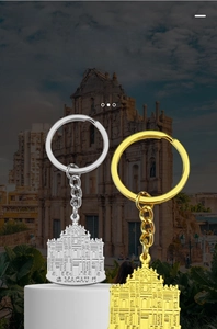 Detailed view of Macau Ruins souvenir keychains in gold and silver zinc alloy