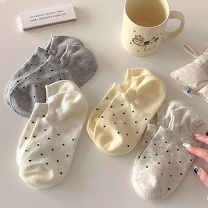 Four pairs of polka dot cotton no-show socks for women in soft neutral colors
