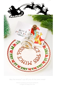 Detailed view of a Christmas ceramic plate with Mince Pies text and festive decor accessories