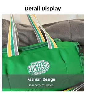 Detail of green canvas sports bag with TOCHASO patch and striped webbing handles