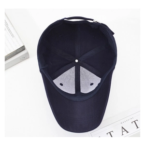 Detailed interior of navy baseball cap featuring white mesh support and metal buckle