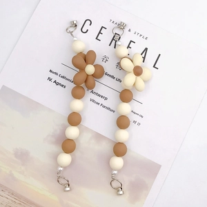 Acrylic flower charm straps in brown and cream tones with elegant pearl accents
