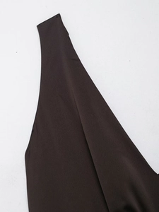 Close-up of elegant dark satin fabric texture and shoulder strap details on evening dress