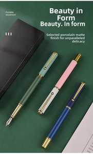 Detail of matte Morandi metal business pens in a gift box with gold accents