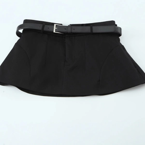 Women's black halter neck top with matching waist belt in a professional flat lay style