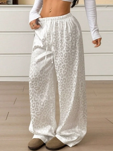 Women's leopard print wide-leg trousers with drawstring waist and satin texture