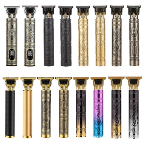 Various T-blade hair clippers with metal engravings and LED display on white background