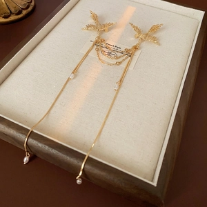 Exquisite gold phoenix brooch with long pearl tassels in traditional Chinese style