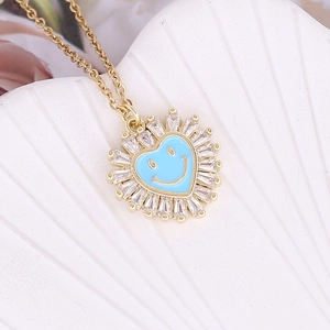Gold-plated necklace featuring a blue enamel heart pendant with smiley face and zircon halo