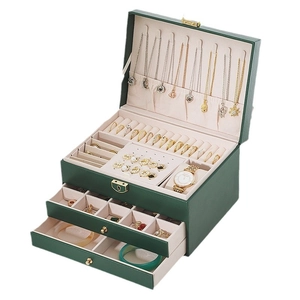 Three-layer dark green leather jewelry box with locks and velvet interior organization