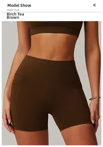 Detail view of birch tea brown high-waisted shorts with side pockets and flatlock seams