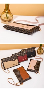 Detailed macro view of retro floral monogram pattern and golden logo on compact PU bag