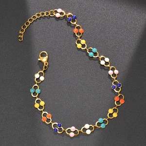 Golden chain bracelet with colorful enamel dots and adjustable lobster clasp closure