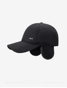 Detail view of winter baseball cap with earflaps and 1988 metal tag in black wool
