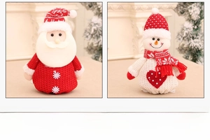 Detail view of plush Santa and Snowman Christmas drawstring bags with knit embroidery