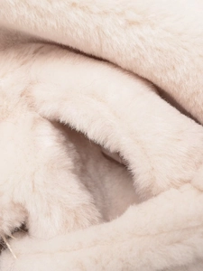 Macro shot of fluffy cream faux fur texture on this stylish French lapel coat