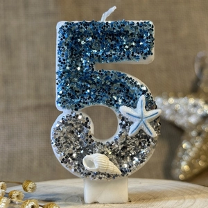 Blue and silver glitter ocean themed number 5 candle with starfish and seashell decor