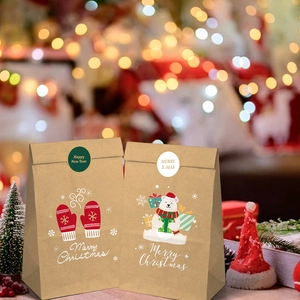 Kraft paper Christmas gift bags with bear and mitten prints including festive stickers