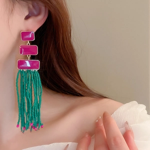Bohemian tassel earrings featuring rose red rectangles and green seed bead fringe detail