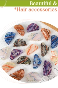 Collection of colorful oil painting style acrylic hair claws on white silk fabric