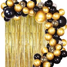 Detailed close-up of a decorative gold fringe curtain background for party balloon arches