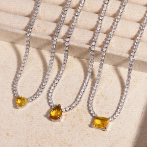 Sparkling silver tennis necklaces with yellow zircon pendants in heart, drop, and square shapes