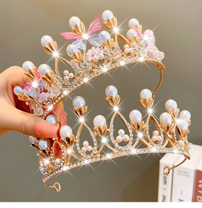 Detail of golden crown headband featuring white pearls, rhinestones and mesh butterfly décor