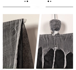 Detailed view of layered white mesh gauze and black fabric on Halloween ghost decoration