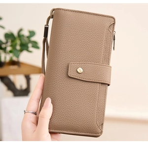 Close-up of khaki pebbled PU leather long wallet with wristlet and snap closure