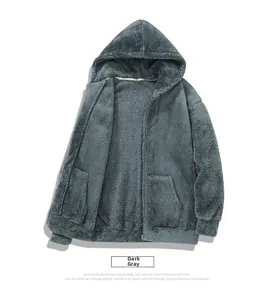Detail of dark gray zip-up fleece hoodie showing thick plush texture and ribbed cuffs
