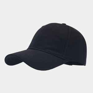 Close-up of black cotton twill baseball cap showing stitch detail and breathable eyelets